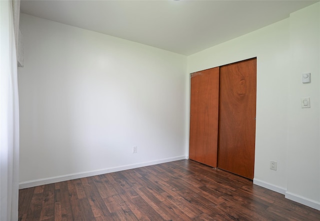 3103 Chelsea Cv S, Hopewell Junction, NY 12533 - unfurnished bedroom with dark wood-style floors and a closet