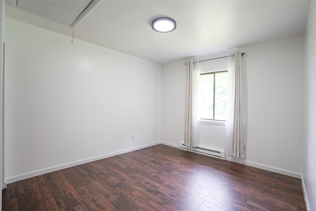 3103 Chelsea Cv S, Hopewell Junction, NY 12533 - spare room with a baseboard radiator, attic access, and dark wood-style floors