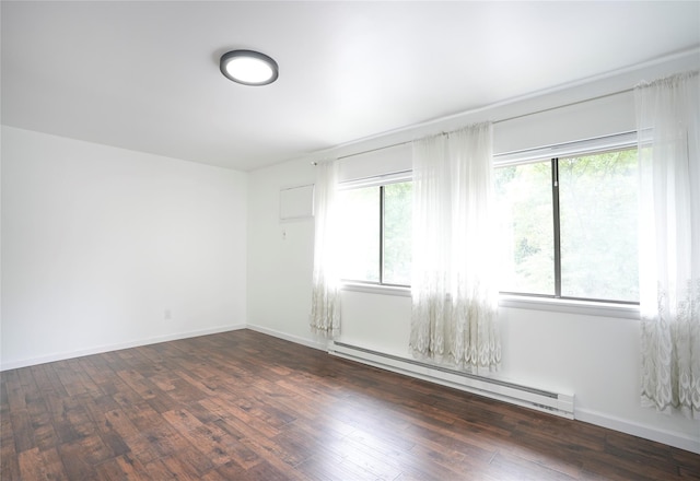 3103 Chelsea Cv S, Hopewell Junction, NY 12533 - unfurnished room with a baseboard heating unit, plenty of natural light, and wood finished floors