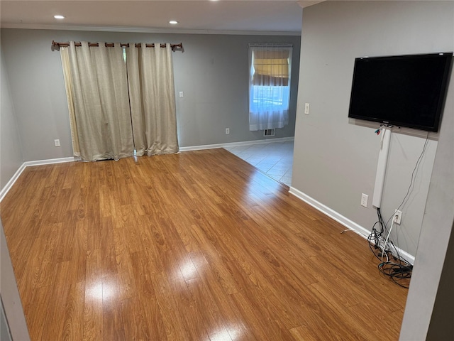 40 New Holland Vlg, Nanuet, NY 10954 - unfurnished living room featuring crown molding, light wood-style flooring, and recessed lighting