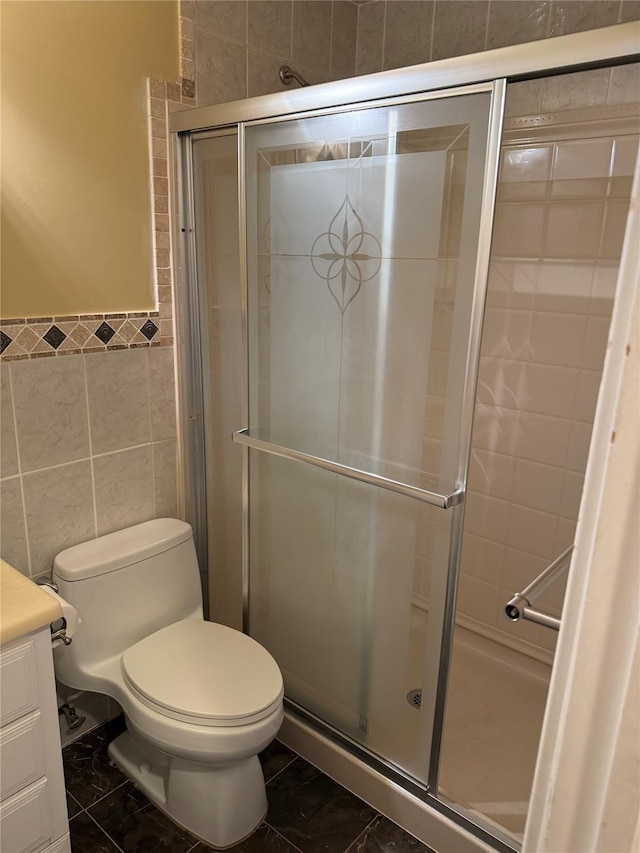 40 New Holland Vlg, Nanuet, NY 10954 - full bath with vanity, tile walls, a shower stall, marble look tile flooring, and wainscoting