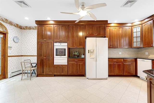 60-14 69th Pl, Maspeth, NY 11378 - kitchen featuring white appliances, a warming drawer, glass insert cabinets, backsplash, and wallpapered walls