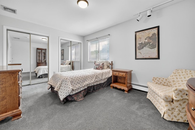 3 Adrian Ct Unit B, Cortlandt Manor, NY 10567 - bedroom with two closets, carpet floors, a baseboard heating unit, and rail lighting