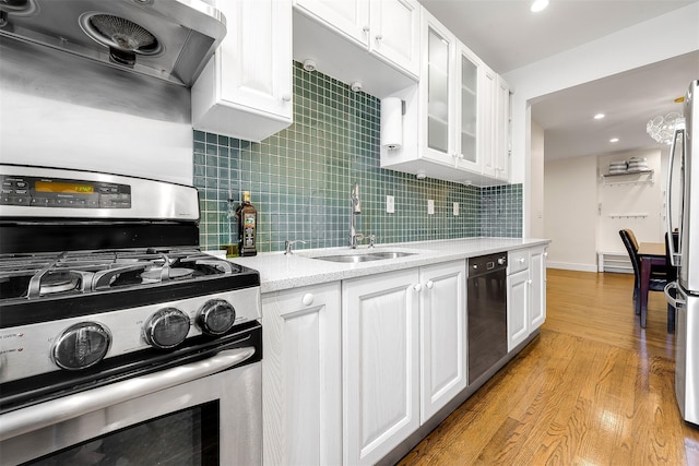 110-34 73rd Rd Unit 5A, Forest Hills, NY 11375 - kitchen with stainless steel appliances, ventilation hood, white cabinets, light wood-style floors, and recessed lighting