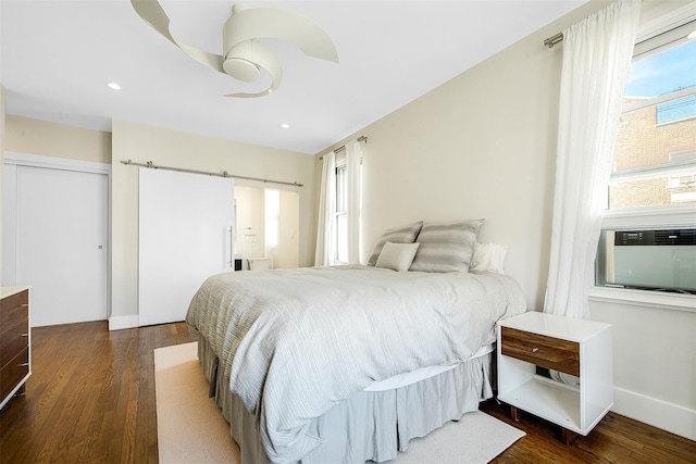 110-34 73rd Rd Unit 5A, Forest Hills, NY 11375 - bedroom featuring dark wood finished floors, a barn door, recessed lighting, and ceiling fan