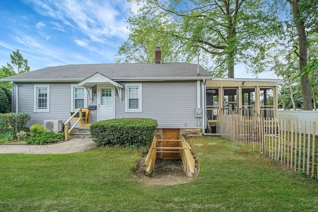 52 Mc Cue Ln, Babylon, NY 11702 - view of front of property with a chimney, a sunroom, and a shingled roof