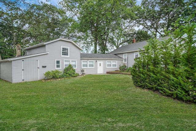 52 Mc Cue Ln, Babylon, NY 11702 - rear view of property with a yard