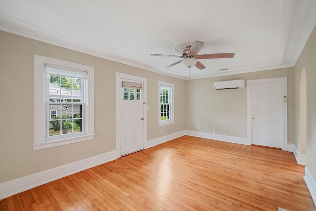 52 Mc Cue Ln, Babylon, NY 11702 - entrance foyer featuring an AC wall unit, light wood-type flooring, ornamental molding, and ceiling fan
