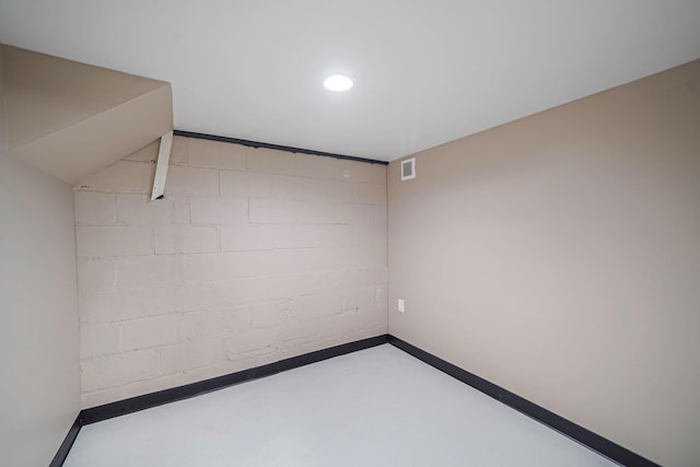 52 Mc Cue Ln, Babylon, NY 11702 - spare room with concrete block wall and concrete flooring