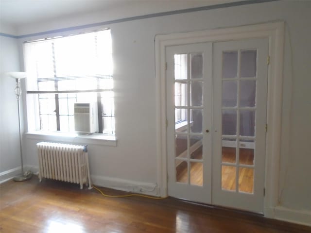 292 Main St Unit 4C, White Plains, NY 10601 - doorway featuring radiator, french doors, and wood finished floors