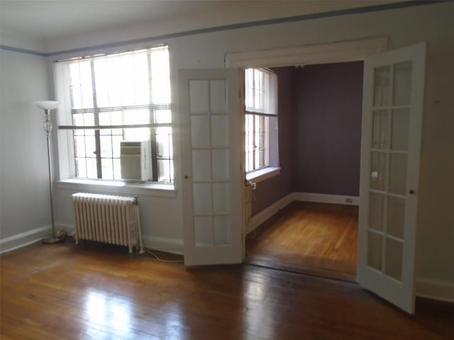 292 Main St Unit 4C, White Plains, NY 10601 - empty room featuring radiator heating unit and wood finished floors