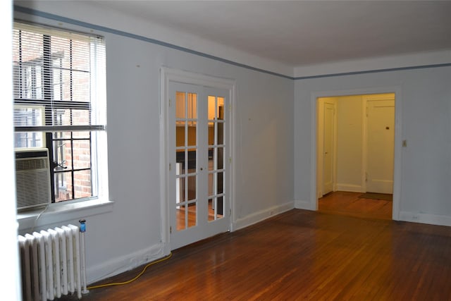292 Main St Unit 4C, White Plains, NY 10601 - empty room featuring radiator heating unit and hardwood / wood-style floors