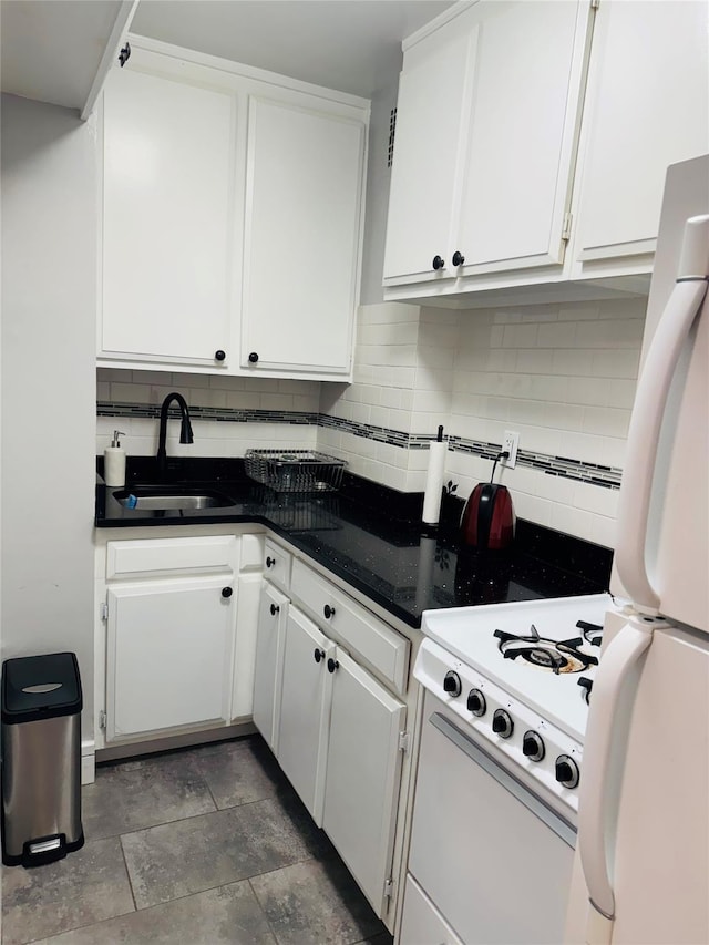 6515 Alderton St Unit 2A, Rego Park, NY 11374 - kitchen featuring freestanding refrigerator, tasteful backsplash, white cabinets, and dark countertops