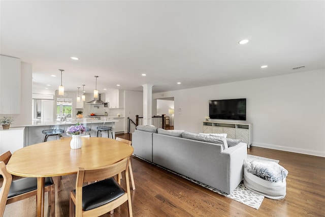 130 Carthage Rd, Scarsdale, NY 10583 - living room featuring recessed lighting, ornate columns, and dark wood-style flooring