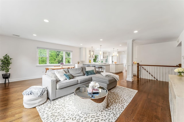 130 Carthage Rd, Scarsdale, NY 10583 - living area with dark wood-style flooring, recessed lighting, and ornate columns