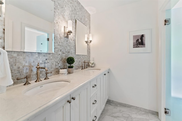 130 Carthage Rd, Scarsdale, NY 10583 - full bathroom featuring double vanity, backsplash, and marble look tile flooring