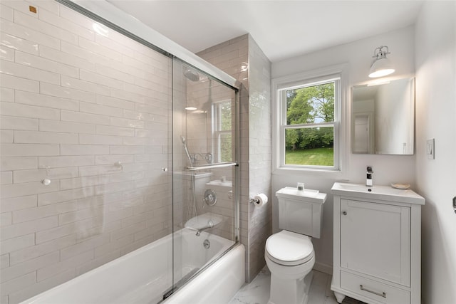 130 Carthage Rd, Scarsdale, NY 10583 - full bathroom with marble look tiles, vanity, and combined bath / shower with glass door