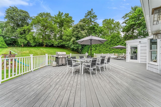 130 Carthage Rd, Scarsdale, NY 10583 - wooden deck with a grill, outdoor dining area, a lawn, and view of scattered trees