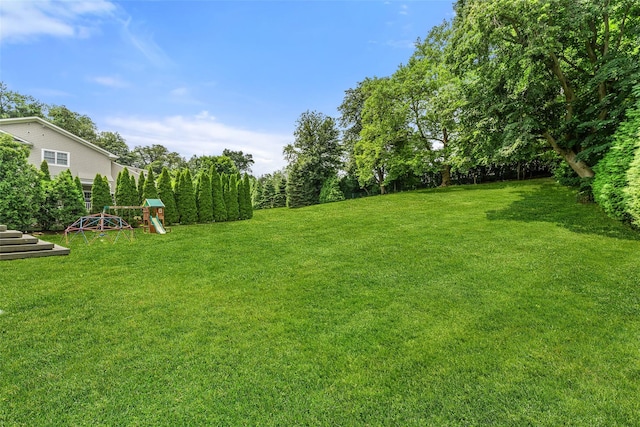 130 Carthage Rd, Scarsdale, NY 10583 - view of green lawn featuring a playground