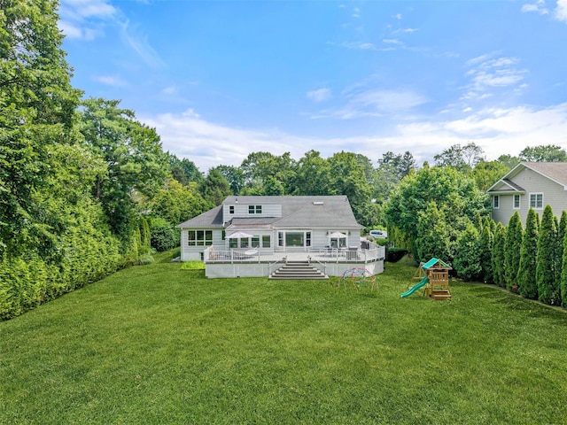 130 Carthage Rd, Scarsdale, NY 10583 - back of property featuring a playground, a yard, and a wooden deck