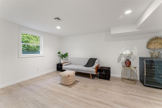 130 Carthage Rd, Scarsdale, NY 10583 - sitting room with wine cooler, wood finished floors, and recessed lighting