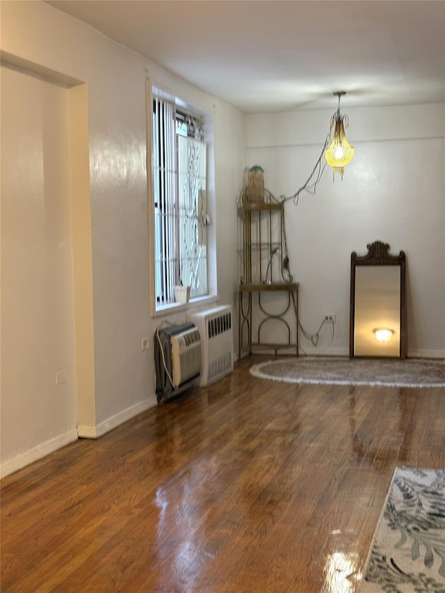 41-31 51st St Unit 6M, Woodside, NY 11377 - unfurnished dining area featuring wood finished floors and radiator