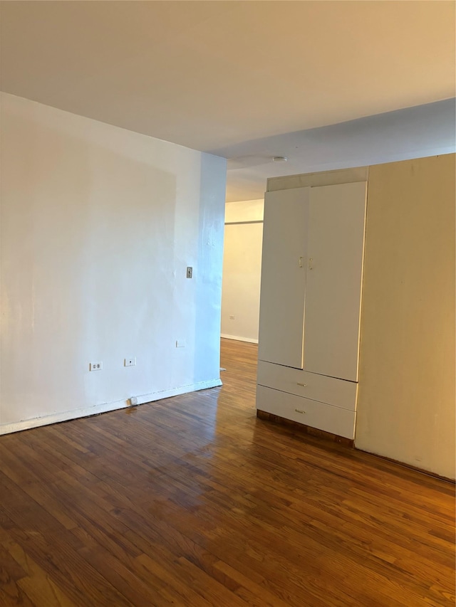 41-31 51st St Unit 6M, Woodside, NY 11377 - empty room with dark wood-style flooring and baseboards
