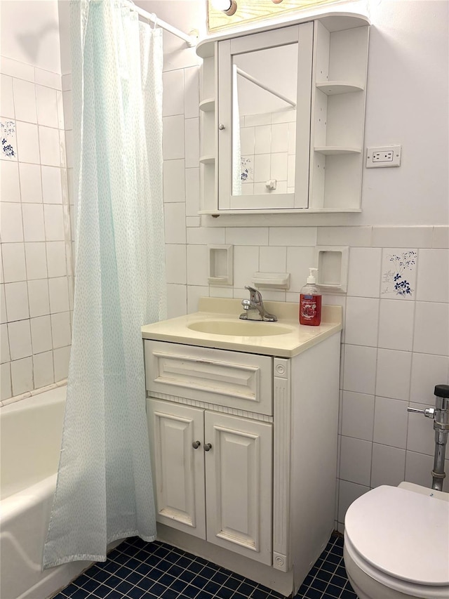 41-31 51st St Unit 6M, Woodside, NY 11377 - bathroom with tile walls, vanity, shower / bath combo with shower curtain, and tile patterned floors