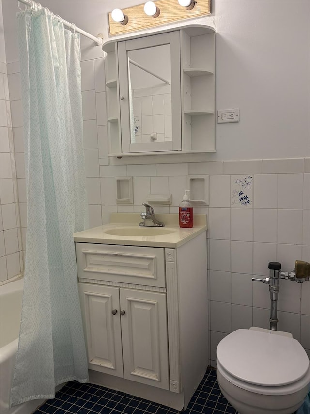 41-31 51st St Unit 6M, Woodside, NY 11377 - bathroom featuring tile walls, shower / bath combo, vanity, and tile patterned flooring