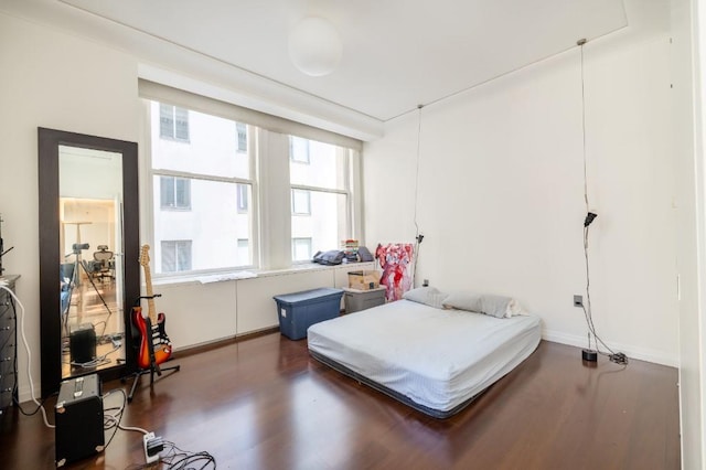 55 Wall St Unit 610, New York Manhattan, NY 10005 - bedroom featuring wood finished floors and multiple windows
