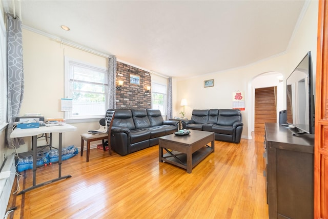 58-44 219th St, Bayside, NY 11364 - living room featuring arched walkways, light wood-style flooring, and crown molding