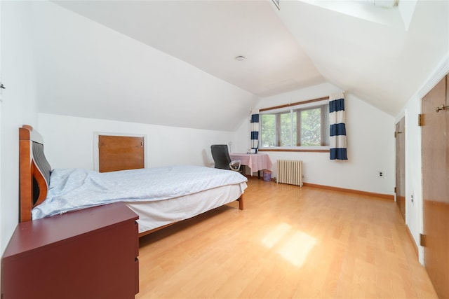 58-44 219th St, Bayside, NY 11364 - bedroom featuring radiator, light wood finished floors, and vaulted ceiling