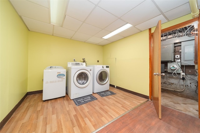 58-44 219th St, Bayside, NY 11364 - laundry room with independent washer and dryer, electric panel, and wood finished floors