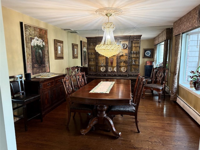 8 Lisa Dr, Dix Hills, NY 11746 - dining area featuring a chandelier, dark wood finished floors, and a baseboard radiator