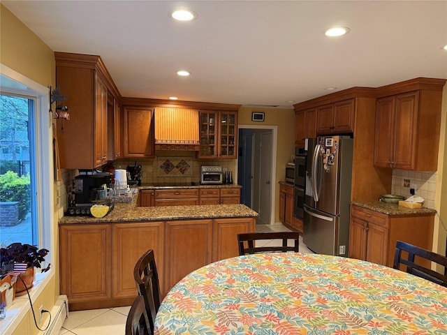 8 Lisa Dr, Dix Hills, NY 11746 - kitchen featuring appliances with stainless steel finishes, wall chimney range hood, backsplash, recessed lighting, and a peninsula