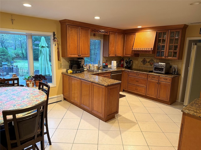 8 Lisa Dr, Dix Hills, NY 11746 - kitchen with range hood, a peninsula, decorative backsplash, brown cabinets, and recessed lighting