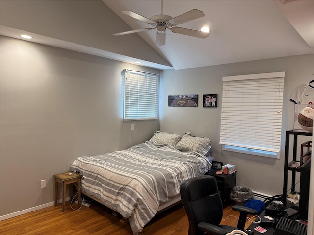 8 Lisa Dr, Dix Hills, NY 11746 - bedroom with vaulted ceiling, wood finished floors, recessed lighting, a ceiling fan, and a baseboard heating unit