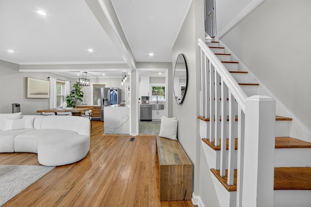 130 Cresthill Rd, Yonkers, NY 10710 - living area with a chandelier, light wood finished floors, plenty of natural light, stairs, and recessed lighting
