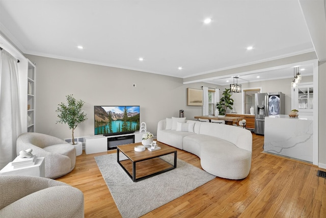 130 Cresthill Rd, Yonkers, NY 10710 - living area featuring crown molding, recessed lighting, and light wood-style floors