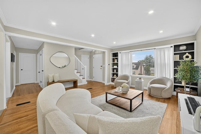 130 Cresthill Rd, Yonkers, NY 10710 - living area featuring stairs, light wood-style flooring, crown molding, and recessed lighting