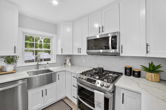 130 Cresthill Rd, Yonkers, NY 10710 - kitchen featuring stainless steel appliances, white cabinetry, and tasteful backsplash