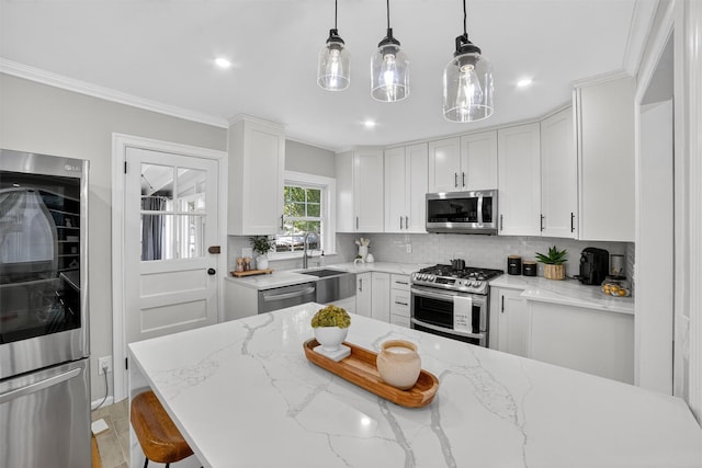 130 Cresthill Rd, Yonkers, NY 10710 - kitchen featuring stainless steel appliances, decorative backsplash, white cabinetry, hanging light fixtures, and crown molding
