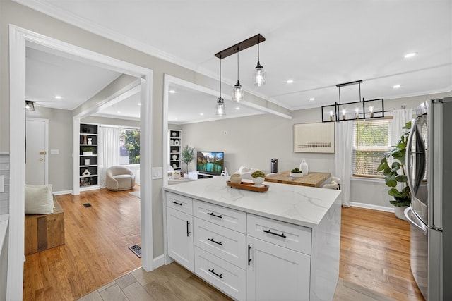 130 Cresthill Rd, Yonkers, NY 10710 - kitchen featuring freestanding refrigerator, healthy amount of natural light, light wood-style floors, white cabinets, and recessed lighting