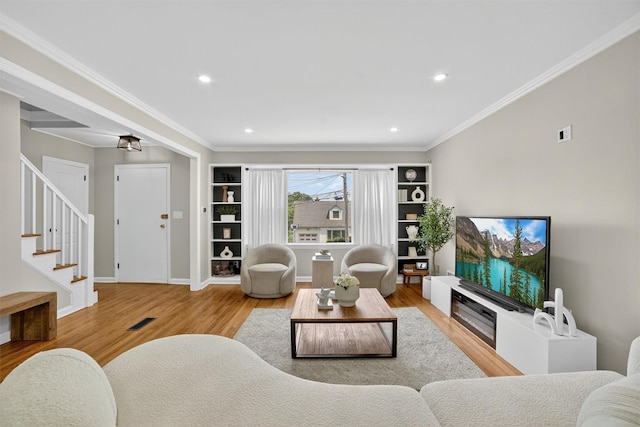 130 Cresthill Rd, Yonkers, NY 10710 - living area featuring wood finished floors, stairway, recessed lighting, and ornamental molding