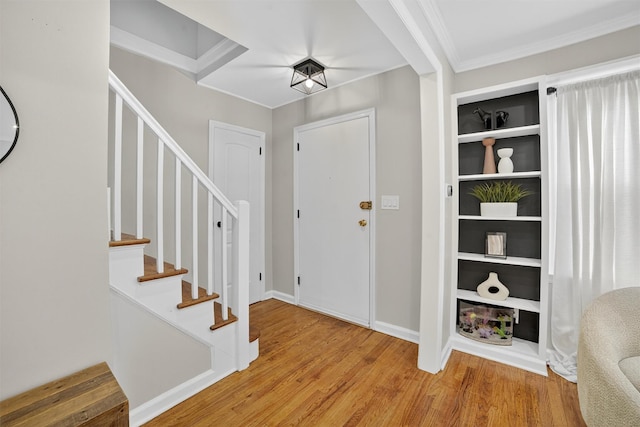 130 Cresthill Rd, Yonkers, NY 10710 - foyer with wood finished floors, stairs, and ornamental molding