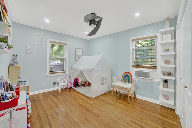 130 Cresthill Rd, Yonkers, NY 10710 - recreation room with wood finished floors, healthy amount of natural light, and cooling unit