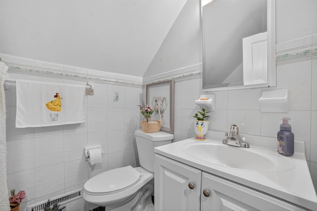 130 Cresthill Rd, Yonkers, NY 10710 - bathroom with tile walls, vaulted ceiling, and vanity