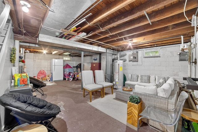 130 Cresthill Rd, Yonkers, NY 10710 - basement with gas water heater, freestanding refrigerator, and electric panel