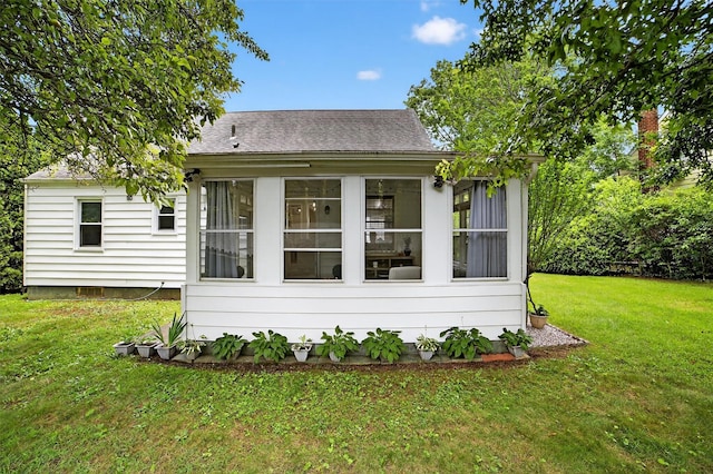 130 Cresthill Rd, Yonkers, NY 10710 - back of property featuring a lawn, a sunroom, and a shingled roof