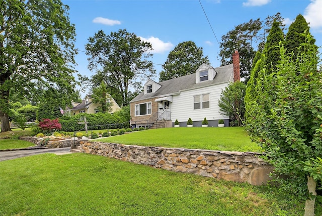 130 Cresthill Rd, Yonkers, NY 10710 - view of front of house featuring a front yard and a chimney